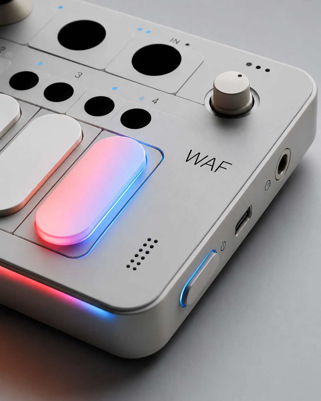 A precision aluminium WAF console with tactile controls and restrained blue and red light